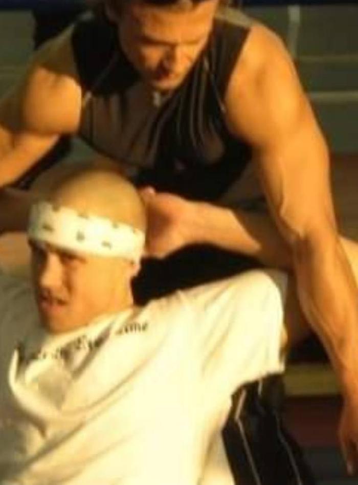Sam Mujkic working on an athlete ringside